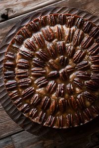 A high altitude tested recipe for soft pecan cake, topped with crunchy caramelized pecans.