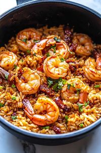 Ingredients:  • 1 lb ground beef • 1 lb ground beef sausage • 10-12 shrimp, deveined • 4 cups cooked rice • 2 cups broth (chicken or other) • 1.5 cups chopped onions and bell peppers • 3 tbsp vegetable oil, divided • 1 tsp seafood seasoning • ¼ cup flour • 1 tbsp oregano • 3 tsp minced garlic • 1 tsp thyme • 1 tbsp garlic powder • 1 tsp onion powder • 1 tsp chili powder • ½ tsp black pepper • ½ tsp salt • Pinch of cayenne pepper  Prep Time: 15 mins | Cooking Time: 30 mins | Total Time: 45 mins | Kcal: 450 per serving | Servings: 6