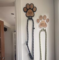 These lead hangers are a great addition to any home and are fully personalised, making these perfect for gifts or as a decoration for your own home :) You can choose between black and white, and your pooches lead hangs onto the hook that comes attached to the plaque! The base plate is made from high quality 3mm acrylic, with 4mm cherry MDF laser engraved with your pets name to create the 3D effect. The plaque measures 19cm x 16cm. **Lead not included**