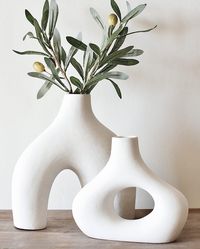 PRICES MAY VARY. Easiest Nordic Home Decor : Place these stunning, trendy pieces in any space - in the living room and dining room, bathroom, bedroom, office, restaurant, and so forth. Amazing Centerpieces : These vases could be used with or without plants absolutely stunning in both ways. Perfectly Handy Size : Check the dimensions. These are in great sizes to go on your dining table, desk, shelf, and kitchen countertop as centerpieces, and decorative objects. Warm White : The perfectly warm, s