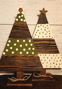 Hand painted wooden plank Christmas trees. 14.5 inches high by 9.5 inches wide. Choose between green polka dot, white with green stars, or a set of two that includes one of each color. Finished with a star with button and a twine bow at the base.