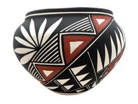 This beautiful pot was handmade by an Acoma artist. 100% Handcrafted by Native American artist! Treat yourself or a loved one to a lovely piece of art. Measurements Height  5.5" Width 7.5"