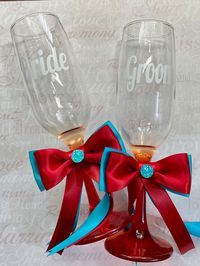 "Wedding cake set and champagne glasses for your Red and Turquoise themed- wedding, \"Bride\" on one glass and \"Groom\" on the other and feature a linked hearts design. 8 3/4\" tall, 6 oz.   Cake Serving Set, stainless steel blades and elegant acrylic handles, cutter is 13\" long and server is 11\" long.  Contact me if you would like to purchase matching basket, pillow, guest book, garters, etc. ** AT THIS TIME ALL ORDERS TAKE 4-5 WEEKS TO MAKE and SHIP OUT** order accordingly. If you need the