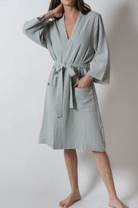 Wrap up in the softest kimono style robe! Made from lightweight and breathable combed cotton, with contrast scalloped edge detailing. Finished with patch style pockets and bracelet length sleeves. The perfect beach cover-up or just for lounging at home, this will be a staple in your Summer wardrobe. Kimono style robe S