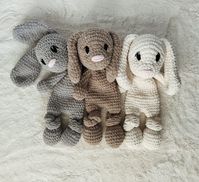 This is a free crochet snuggler pattern of the cuddly classic puppy! Half stuffed animal, half blanket but twice the fun! This crochet dog lovey would be a great crocheted nursery gift! Embroidered eyes and blanket yarn make it more baby friendly.