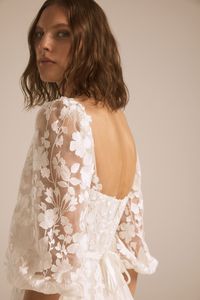 Degradé floral embroidered high fit-to-flare gown with U-neck bodice and balloon sleeve detail. Shown in Ivory.