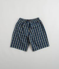 Description Gramicci OG Yarn Dye Shadow Plaid Jam Shorts Gramicci OG Yarn Dye Shadow Plaid Jam Shorts in Blue. Made from 100% dobby plaid fabric, these relaxed fitting Gramicci shorts are designed with an elasticated waist and an integrated webbing belt. Finished in a shade of navy plaid with two side pockets, a single rear pocket and with woven flag label branding. Established during the early ‘80s by climber Mike Graham, Gramicci is a visionary outdoor brand known also for their recent Japanese streetwear revival. Searching for freedom in movement with a focus on comfort, durability and revised mountain necessity, Gramicci is an explorative brand that continues to redefine outdoor styling. Product Details 100% Dobby Plaid Yarn Dyed Fabric Elasticated Waist with Integrated Belt Two Side S