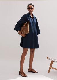 ME+EM's Navy Cotton Poplin Swing Dress + Belt is imbued with elastane to create an unexpected but desirable stretch for wear-all-day comfort. Shop now.