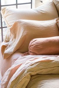 Austin Deluxe Shams in Honeycomb, Paloma Standard Pillowcases in Rouge, Paloma Bolster in Rosegold, Linen Sheets in Rouge, Austin Queen Duvet Cover in Honeycomb