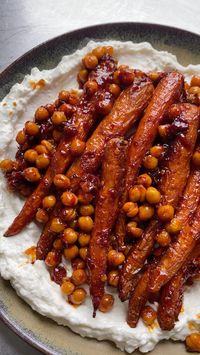 Delicious, spicy sweet carrots on a bed of creamy whipped feta, perfect with some warm flatbreads.