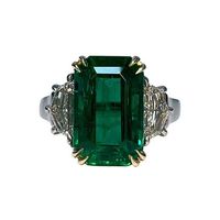 Emerald Weight: 4.23 CTs, Measurements: 12.38 x 7.95 x 5.93 mm, Diamond Weight: 0.84 CTs (G-VS), Metal: Platinum/18K Yellow Gold, Ring Size: 7, Shape: Emerald-Cut, Color: Green, Hardness: 7.5-8, Birthstone: May, CD Certified