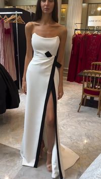 This elegant white sheath prom dress is perfect for any formal occasion. Made with high-quality materials and a sleek design, it will make you stand out from the crowd. Its timeless style and flattering fit will make you feel confident and stunning.