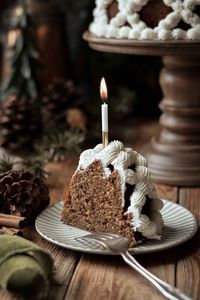 Dark, moist and spicy gingerbread bundt cake, decorated with piped vanilla buttercream.  This high altitude tested recipe is perfect for Thanksgiving and Christmas baking.