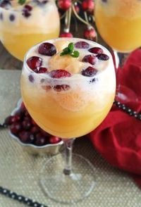 Orange Cranberry Mimosa Floats are so beautiful and festive for the holiday season! Just use your favorite bottle of champagne, add some cranberries, orange sherbert and a dash of cranberry juice. There is no reason to limit yourself ...have one for brunch, lunch, dinner, dessert or a snack. The sweet bubbly texture of the champagne is perfection with the sherbert. I don't think I will be making another mimosa without turning it into a float...another yum situation!