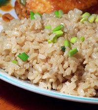 Garlicky Brown Rice - olive oil - brown rice - 6 garlic cloves - canned chicken broth - green onions