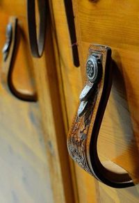 Decorating a home with unique and personal pieces is how you make a house a home. It’s fun to repurpose horse related items and incorporate them into your decor. Stirrups occasionally need to be replaced so instead of throwing them out, repurpose them! 1. They make beautiful handles when you cut them in half. Photo […]