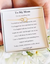 Mother of the Bride Wedding Day Gift from Daughter to Mom This dainty bracelet makes the perfect sentimental gift to give your mom on your special day. We are always happy to change the text for mother of the groom, grandmothers, best friends, etc!! Want to change it, we can make the card more personal if you provide the text. Please remember the card is only 3.5 inches by 3.5 inches so extended wording will require smaller font sizes.  Details: 14 k Gold dipped interlinking circle charms are co