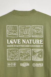 Love Nature tee by Parks Project. Nature-inspired tee features graphics at the chest pocket and back, complete with a ribbed crew neck and short sleeves. Features Love Nature tee from Parks Project Front and back graphics Ribbed crew neck Chest pocket Short sleeves Content + Care Cotton Machine wash Imported Size + Fit Measurements taken from size Medium Chest: 22" Length: 28" | Parks Project Love Nature Tee in Fern, Men's at Urban Outfitters