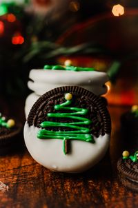 These delightful Christmas Oreos are the perfect holiday treat! Store bought Oreo cookies are dipped into melted white chocolate, decorated with a simple (yet adorable) Christmas tree motif, then sprinkled with colorful nonpareils.