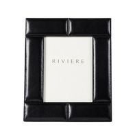 The unique picture holder is stitched with fine leather and features light padding for a subtle but stunning dimensional effect. Chic and versatile, the timeless frame is welcome in any home collection. leather picture frames, picture frame, picture frames, luxe picture frame, black picture frame