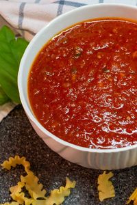 Quick and delicious basic tomato sauce made from fresh tomatoes, basil, bay leaf, and garlic. This sauce is perfect to use with pasta, meat, or you can use it as a basic pizza sauce. #tomatoes #sauces #basicingredients #healthy #homemade