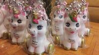 Unicorn piggy banks used as table Centerpieces and made of ceramic.