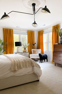 These gold velvet blackout curtains really pop in this bedroom makeover. The yellow warms the room. These affordable velvet curtains come in 12 different colors.