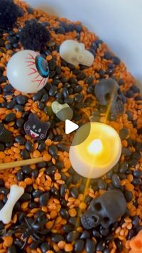 Stephanie | low-prep learning through play on Instagram: "Eerily simple sensory filler 💀🎃

It’s #simplesensorysaturday and we have the best spooky season sensory hack! 

If you’re looking for a perfect Halloween sensory filler without the prep… just grab a package of black beans and a package of red lentils. Done. ✔️ 

We added some festive goodies and battery operated tea lights to complete the spooky vibe. 

#diysensoryplay #sensoryplay #simpleplayideas #fallsensorybin #preschoolactivities #diyplay #lowpreplearningideas #learnthroughplay"