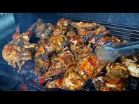 Jerk Chicken, slowly cook on the grill. Authentic Jamaican Jerk Chicken Recipe