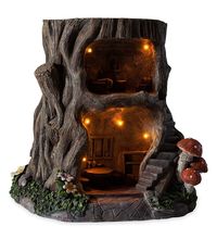 PRICES MAY VARY. Two-story house in a stump Furnished lower floor kitchen and upper floor bedroom LED lights throughout Two AA batteries required (not included) Cast in weather-resistant resin for long outdoor life Local fairy-folk will be very happy when you set out this fully-furnished, Two-Story Lighted Fairy House in a stump. The ground floor is the kitchen/dining area complete with table and chairs and a buffet. Up the curving stairway, you'll find a cozy bedroom with a bed, dresser, side t