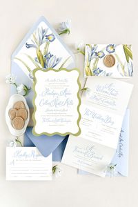 Introducing Penelope, a suite full of life through color, typography, and botanical illustration. Featuring a bright color palette of azure blue and chartreuse, an on-trend wavy edge invitation, and playful script lettering balanced by a sleek secondary typeface. Complete with color envelopes, a tri fold weekend details insert, and finished with a prosecco wax seal.