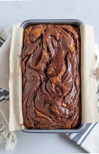 This banana bread is loaded with bananas making it super moist. Nutella swirled into the batter takes this banana bread over the top! #bananabread #bananaandnutella #quickbread #nutella