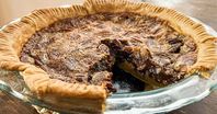 This chocolate pecan pie is like the original, but with the addition of chocolate chips that melt into a fudgy layer as the pie bakes. A holiday treat!