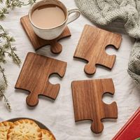 Puzzle-Shaped Interlocking Wooden Veneer MDF Coaster Set Enhance your coffee moments with a stylish and functional touch! Made from MDF with a wooden veneer, these interlocking puzzle-shaped coasters are both practical and decorative. With a natural wood finish, they bring warmth to any space in your home, and the unique puzzle design offers a fun and creative experience. Features: Material: Durable and eco-friendly MDF with wooden veneer Design: Puzzle-shaped interlocking pieces can be arranged