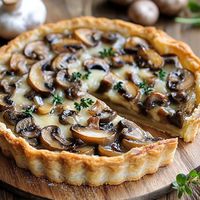 French Onion Mushroom Tart  Ingredients:  1 sheet puff pastry, thawed 2 tbsp butter 1 large onion, thinly sliced 1/2 lb mushrooms, sliced Salt and black pepper, to taste 1 tsp fresh thyme leaves 1/2 cup Gruyère or Swiss cheese, grated 1/4 cup heavy cream 1 egg, beaten (for egg wash) Fresh parsley, for garnish  Instructions:  Preheat oven to 400°F (200°C). Roll out puff pastry on a baking sheet and score a 1-inch border around the edges. In a skillet, melt butter over medium heat. Add onions and cook until caramelized, about 15 minutes. Add mushrooms, salt, pepper, and thyme; cook until mushrooms are tender. Stir in heavy cream and cook for another minute until slightly thickened.   Prep Time: 15 mins | Cook Time: 25 mins | Total Time: 40 mins | Kcal: 300 | Servings: 6