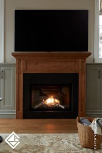 Step into this cozy living room, where every detail invites relaxation and comfort. The warm, earthy grey-toned cabinets create an inviting atmosphere, beautifully paired with a rich wormy maple mantle and surround. 🌿✨...#Fireplace #FireplaceMantel #CozyLivingRoom #TraditionalFarmhouseDesign