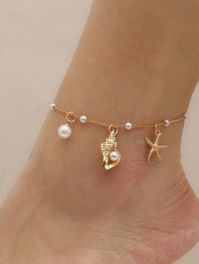 Dive into summer with our Ocean Breeze Anklet, a delicate piece that captures the enchanting beauty of the sea. This dainty gold anklet features a charming starfish, a tiny conch shell, and luminous pearls, evoking the serene vibes of a beach getaway. Lightweight and effortlessly chic, it's perfect for adding a touch of coquette elegance to your summer wardrobe. Embrace the ocean's magic with every step you take!