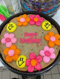 12” chocolate chip cookie decorated with buttercream icing