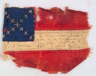 A small Bible flag that belonged to a Southern lady whom recorded the birth of a child on front of flag.