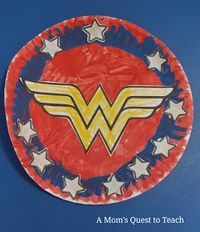 A Mom's Quest to Teach: Crafts: Wonder Woman Paper Plate Shield – Design your own stylized Wonder Woman shield with your children and prepare to fight evil! #kidscrafts #crafts #WonderWoman