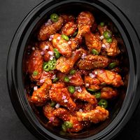 I love the convenience of slow-cooker recipes for get-togethers. Start these sweet and sour chicken wings a few hours ahead of time and you'll have fantastic appetizers ready when your guests arrive. —Ida Tuey, South Lyon, Michigan