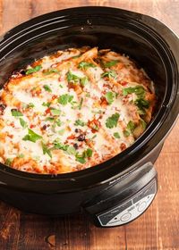 An easy recipe for slow cooker enchiladas with black beans and cheese. Vegetarian.