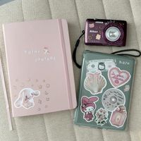 bullet journal, diary, sticker, sanrio, aesthetic, instant camera, nikon, kindle, emotional support kindle, amazon kindle, kindle stickers, e-reader, bookworm gifts, book lover gifts, bookish gifts, amazon finds, kindle aesthetic, book aesthetic, book girlie, book girlie aesthetic