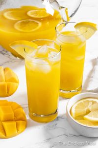 This mango lemonade is summertime, sunshine-on-the-patio, bliss in a cup! And that's not even overselling it. It's refreshing, tropical, and super juicy - since it's made with real mangoes. Learn how to make mango lemonade in minutes and serve it up at your next backyard bbq! #theendlessmeal #mangolemonade #lemonade #mango #mangoes #drink #mangodrink #summer #summertime #recipe