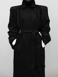 Uber stylish oversized maxi cotton trench coat made from 100% cotton. High neckline with wrap closure across collarbone. Tied waist and padded shoulder details. Model is wearing MINUSEY ONE SIZE. ✔️ Free worldwide express shipping over $100✔️ Loved by 6,500+ customers✔️ Limited edition collections, maximum style⠀⠀⠀⠀⠀⠀⠀⠀⠀Stay ahead of the trend with can’t-find-anywhere-else staples. Your closet will thank you 💕 * MINUSEY ONE SIZE = EU 34-38, US 2-6* 100% Cotton* Dry clean* Made in Korea - Model Height: 170cm/5'7" (US2, EU34)