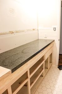 When we updated our boys bathroom makeover to accommodate my tall son, the most asked question we received was how to easily make a bathroom countertop taller.