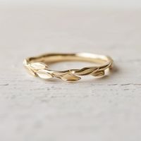 Elegance meets nature in our wedding band, featuring a thin, textured shank with delicate leaves. This minimalist design embodies the beauty and simplicity of the natural world. *Shank - Solid silver, 14k gold, 14k rose gold, 14k white gold.  Check other matching band: https://www.etsy.com/shop/JadedDesignNYC?ref=seller-platform-mcnav§ion_id=48189975 *The Jewelry in my store is packed with nice gift box.  Gift Boxes: To keep costs low and to prevent excess waste, multiple rings and earrings may