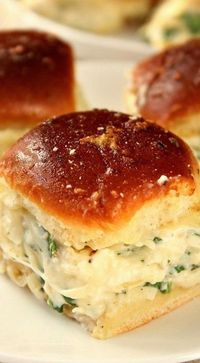 Cheesy Spinach Artichoke Dip Sliders recipe - baked garlic butter slider buns with spinach artichoke dip and cheese. Taking dip to a new level for one amazing party appetizer!