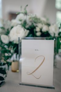 Gold table numbers in acrylic rentable frames, perfect for any wedding reception | Paper Daisies Stationery  @paperdaisiesstationery #weddinginspiration #weddingdecor #wedding #weddingstationery #weddinginvitations #weddingideas #weddingreception #letterpressedinvitations #savethedate #weddingstationary #customweddinginvitations #onlineweddinginvitations #weddingday #tablenumbers