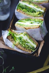 Green Goddess Sandwiches. Avocado, mozzarella, tomato, cucumber, pickled onion, sprouts, and lettuce with green goddess mayo.